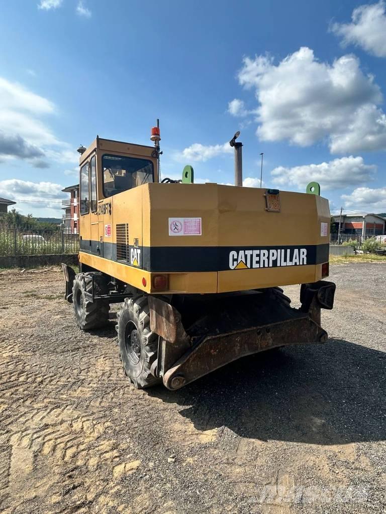 CAT 214 Ratiniai ekskavatoriai