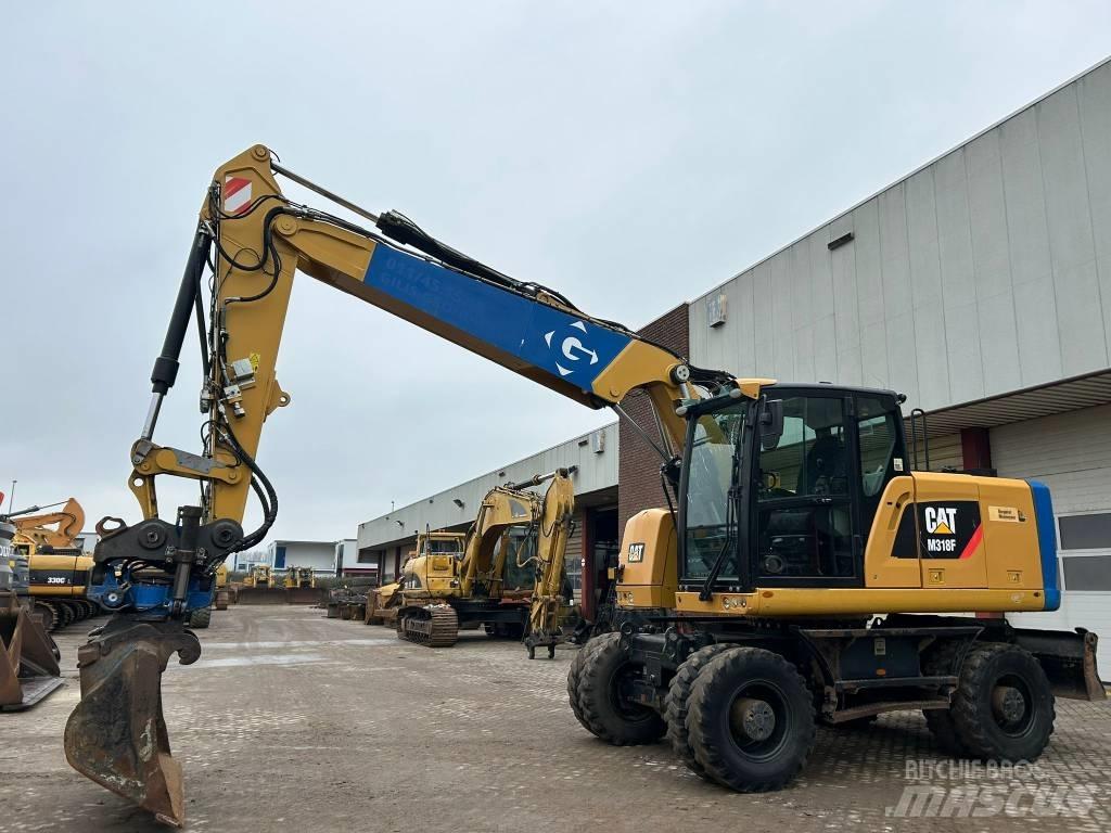 CAT M 318 F Ratiniai ekskavatoriai