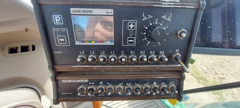 John Deere 840 i Prikabinami purkštuvai