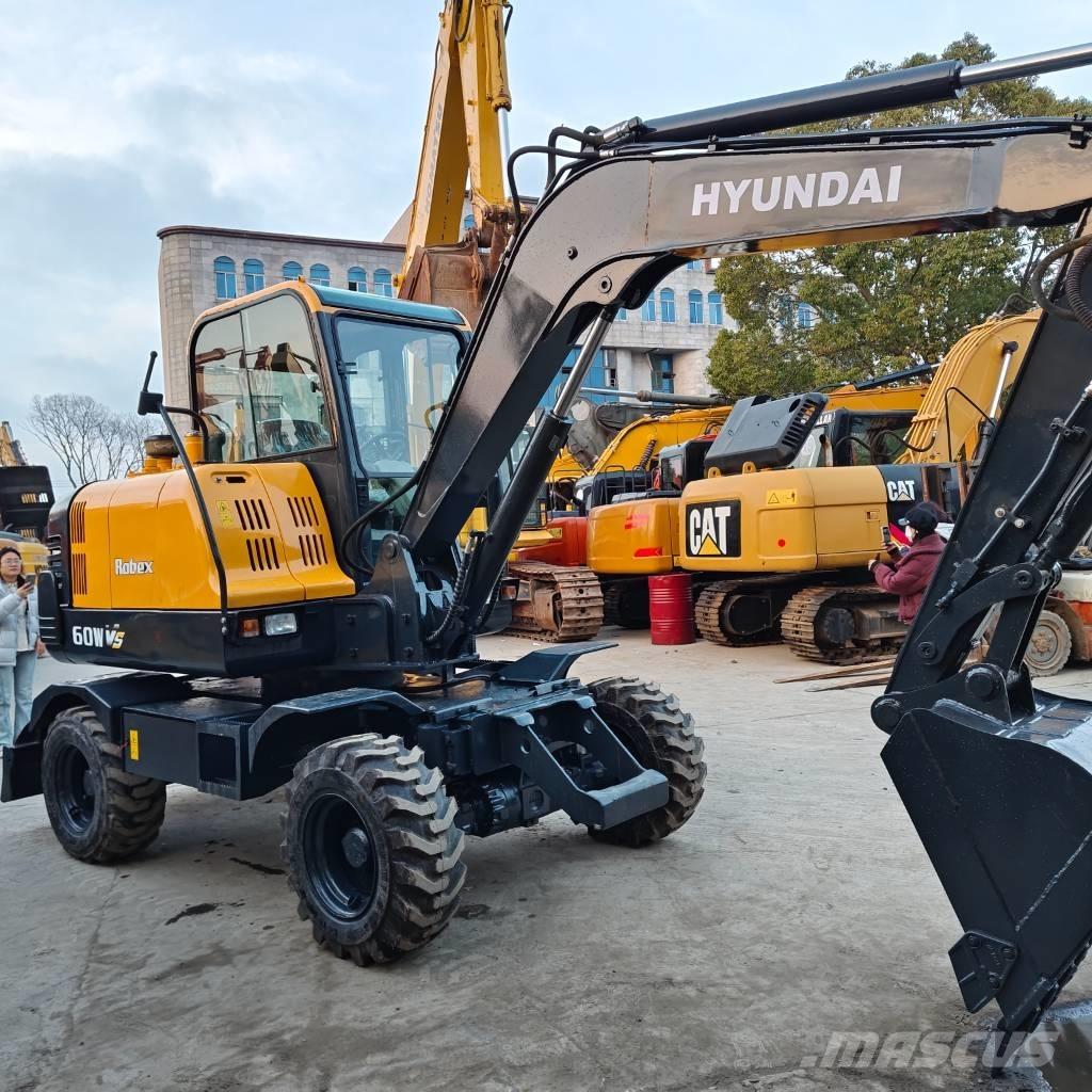 Hyundai 60 W VS Ratiniai ekskavatoriai