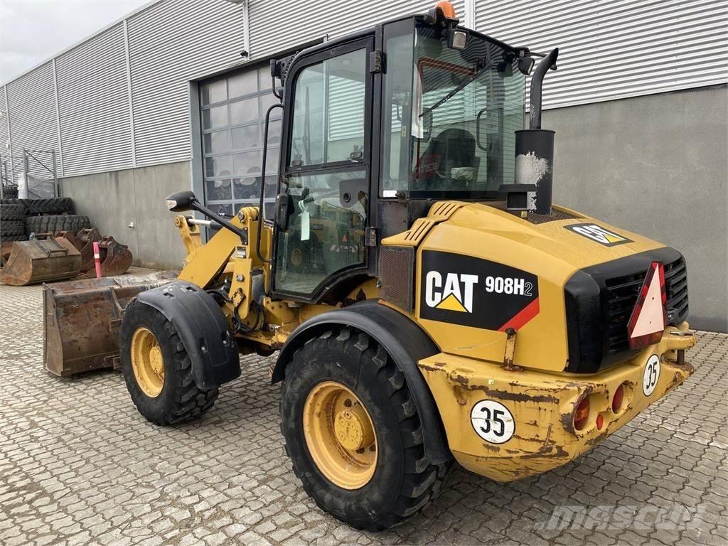 CAT 908 H2 Daugiafunkciniai pakrovėjai