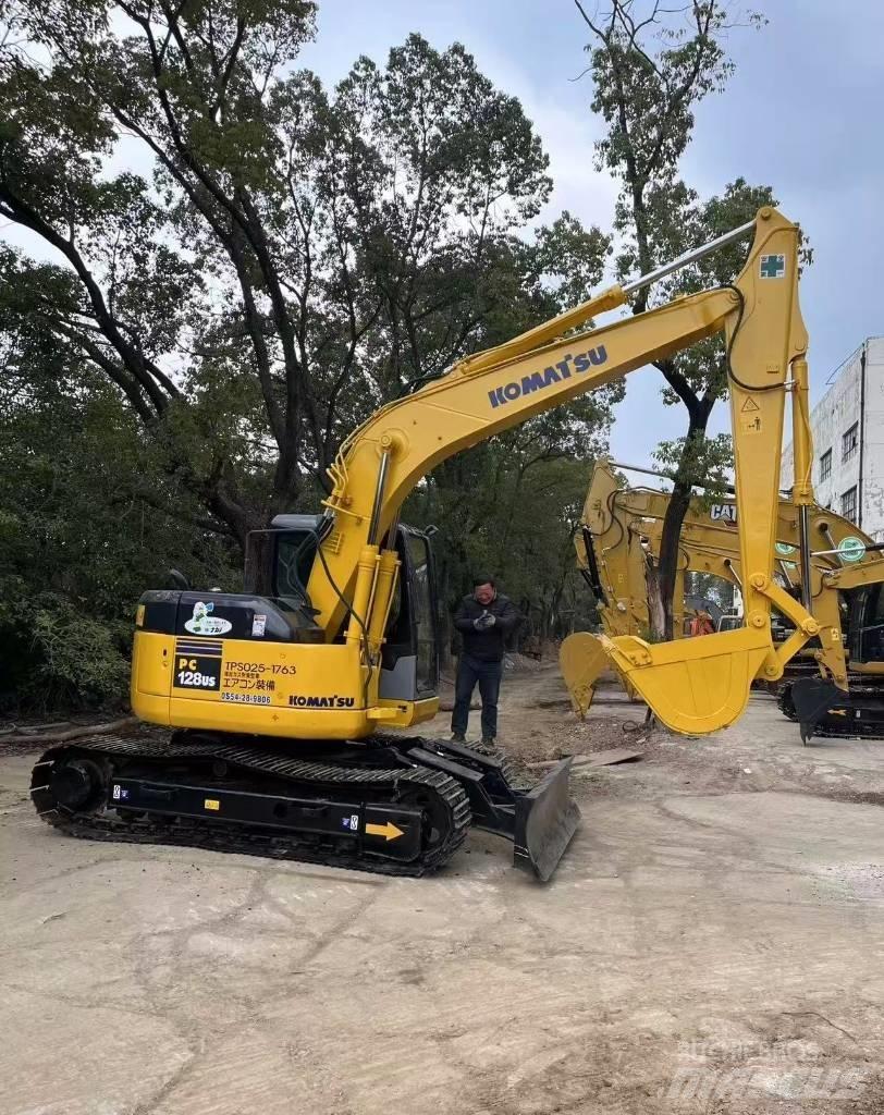 Komatsu 128 US Vikšriniai ekskavatoriai