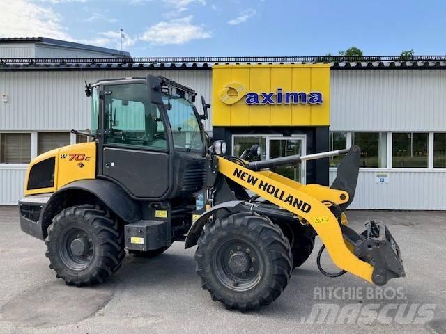 New Holland W70c Naudoti ratiniai krautuvai