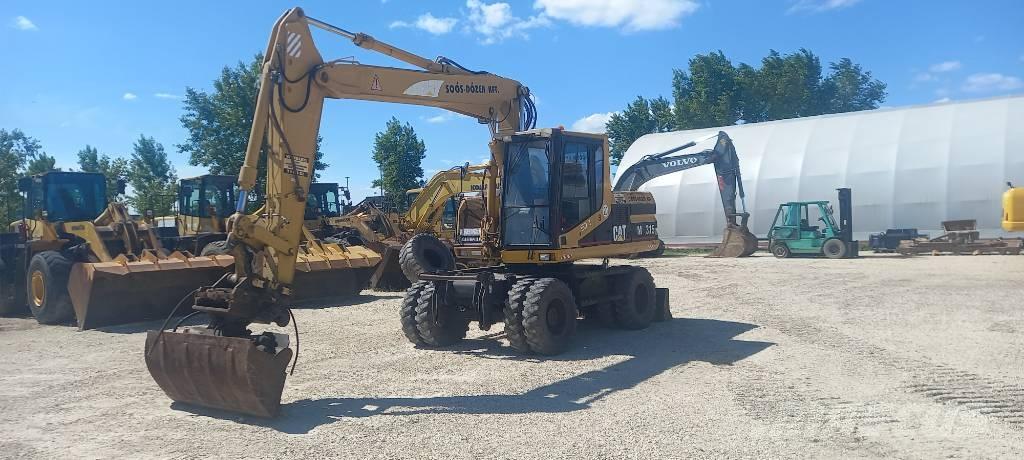 CAT M 315 Ratiniai ekskavatoriai
