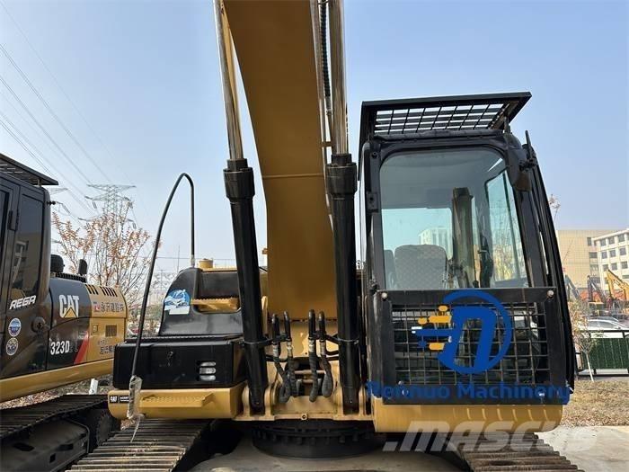 CAT 323D/323/323DL Vikšriniai ekskavatoriai