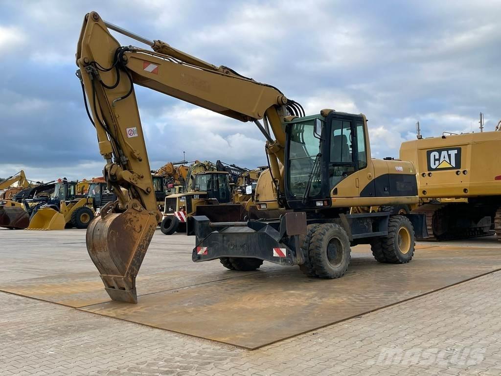 CAT M318C Ratiniai ekskavatoriai