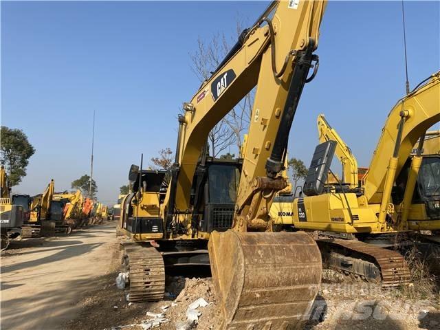CAT 318D Vikšriniai ekskavatoriai