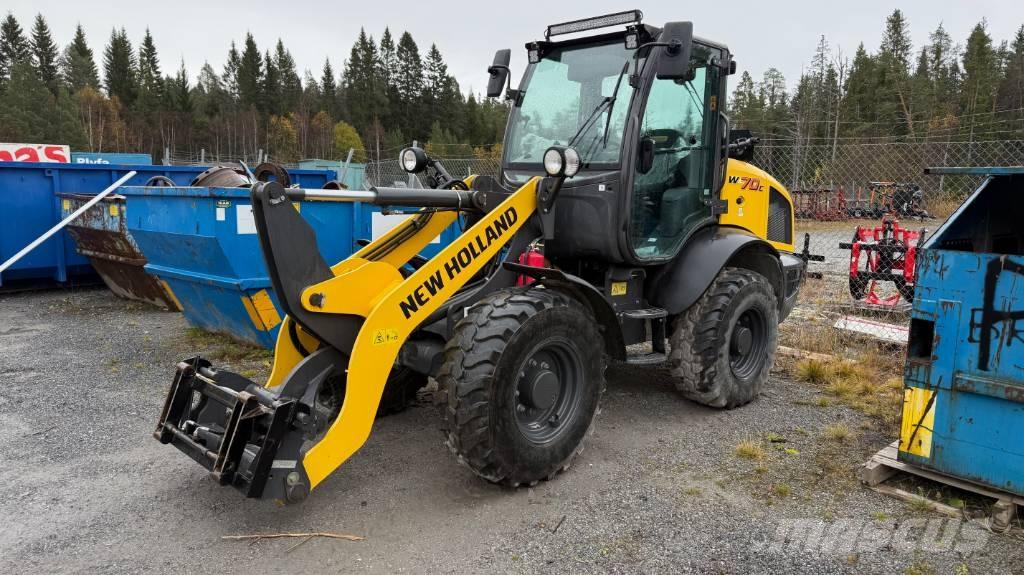 New Holland W70C Naudoti ratiniai krautuvai
