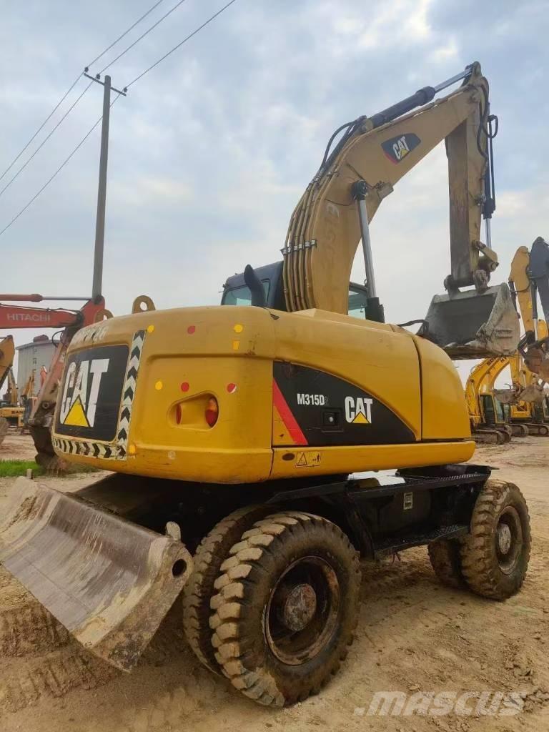 CAT M315D2 Vikšriniai ekskavatoriai