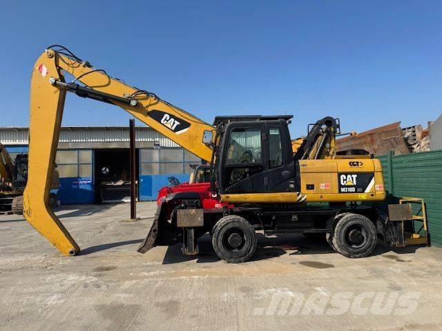 CAT 318D MH Krovimas/Kėlimas - Kita