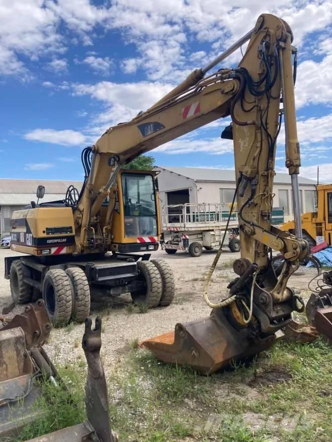 CAT M 312 Ratiniai ekskavatoriai