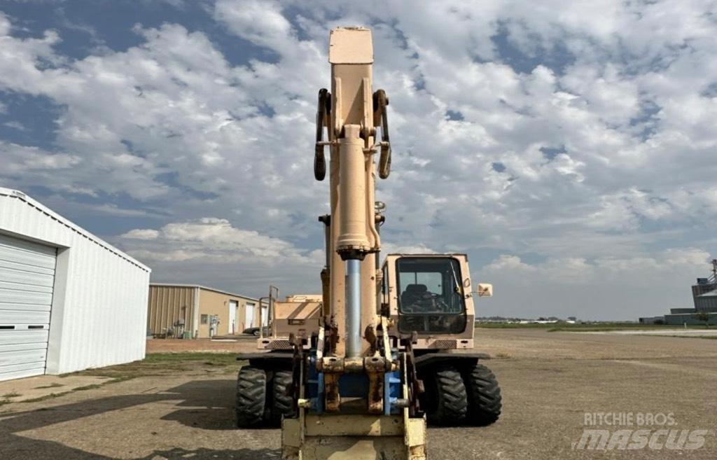 John Deere 595 Ratiniai ekskavatoriai