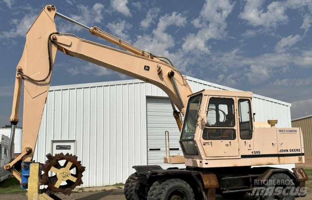 John Deere 595 Ratiniai ekskavatoriai