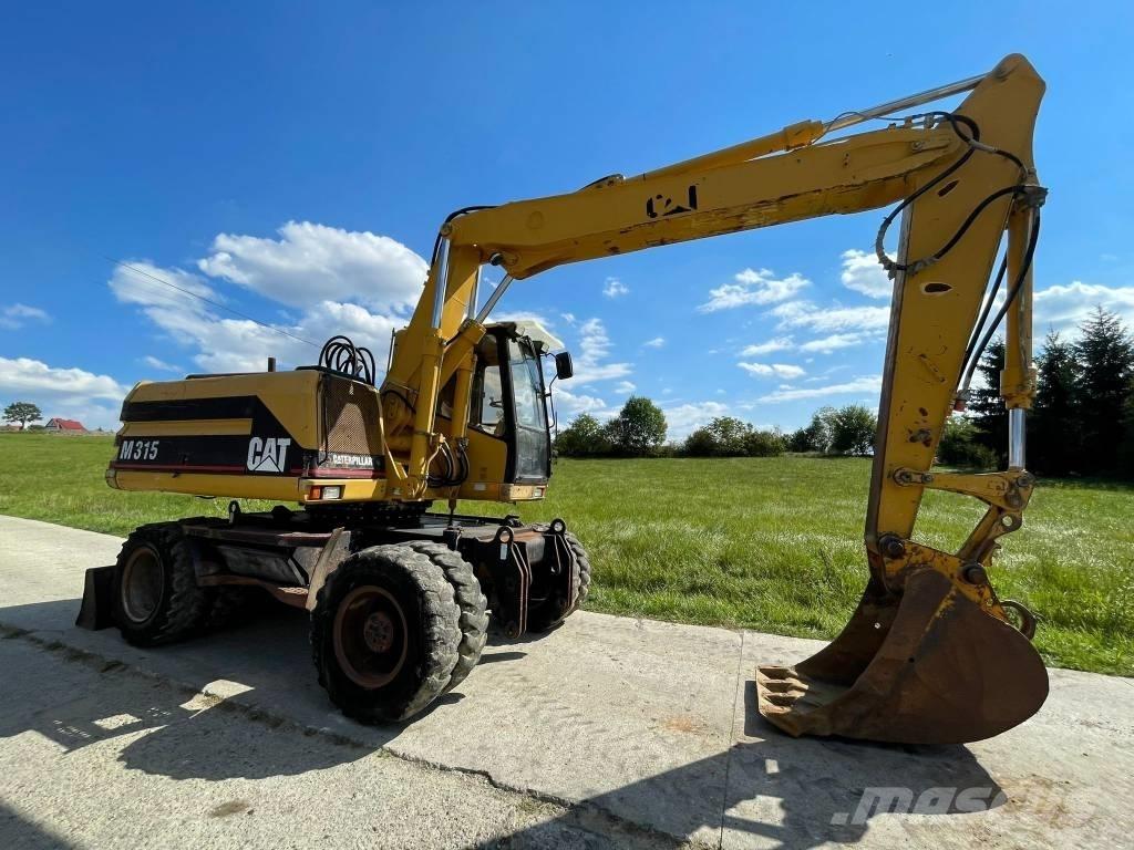 CAT M 315 Ratiniai ekskavatoriai
