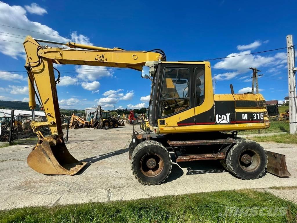 CAT M 315 Ratiniai ekskavatoriai