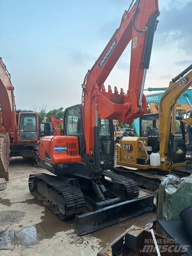 Doosan DX 60 Vidutinės galios ekskavatoriai 7-12 t