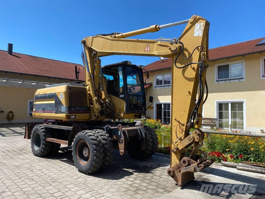 CAT M 312 Ratiniai ekskavatoriai