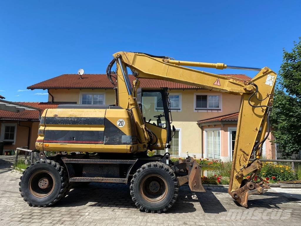 CAT M 312 Ratiniai ekskavatoriai