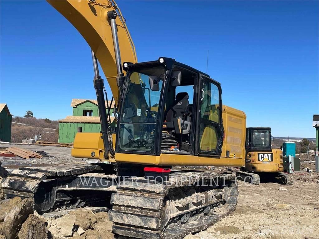 CAT 323 Vikšriniai ekskavatoriai