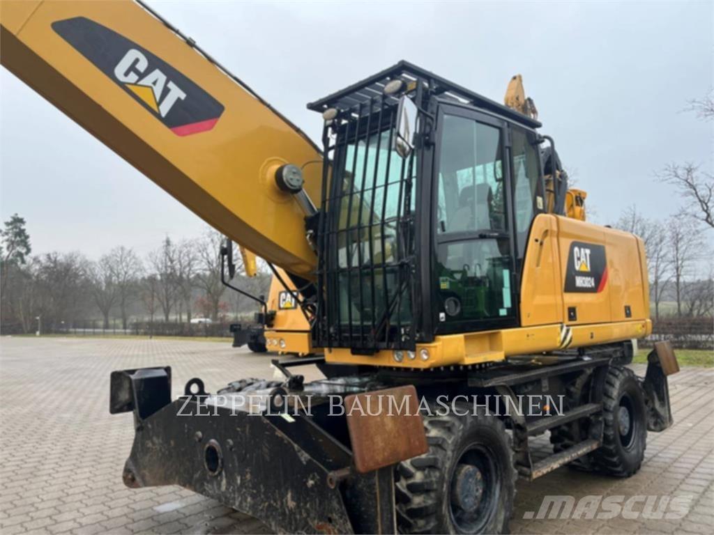 CAT MH3024 Griovimo ekskavatoriai