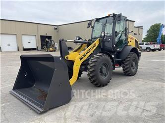 New Holland W80C Naudoti ratiniai krautuvai