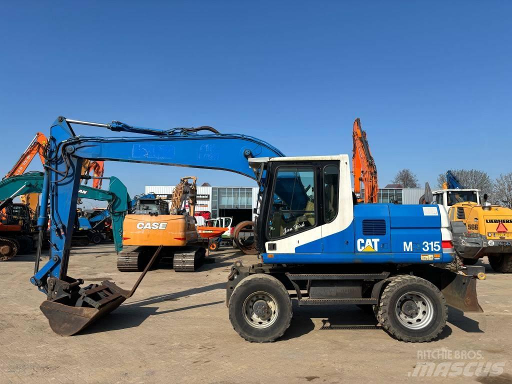 CAT M 315 Ratiniai ekskavatoriai