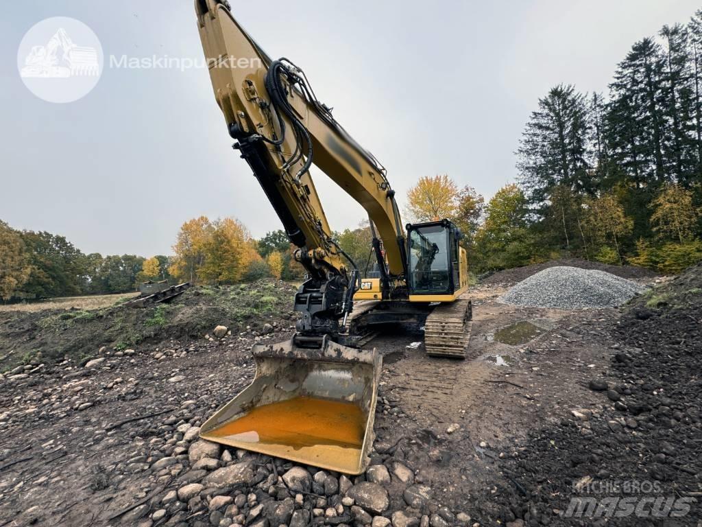 CAT 323 Vikšriniai ekskavatoriai