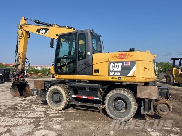 CAT M315D Ratiniai ekskavatoriai