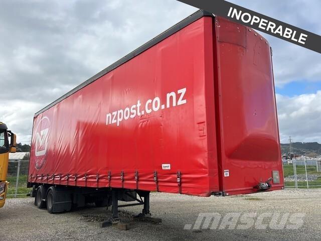 Fruehauf  Priekabos su tentu