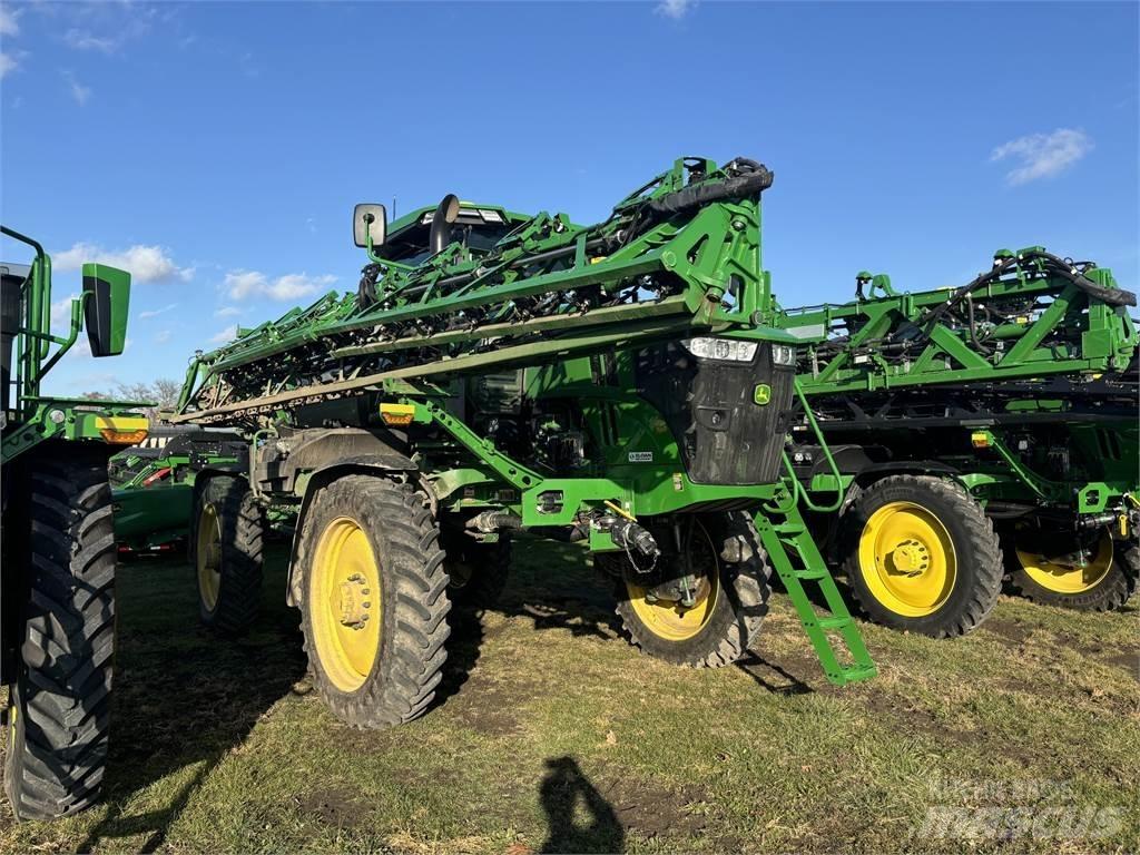 John Deere 412R Prikabinami purkštuvai