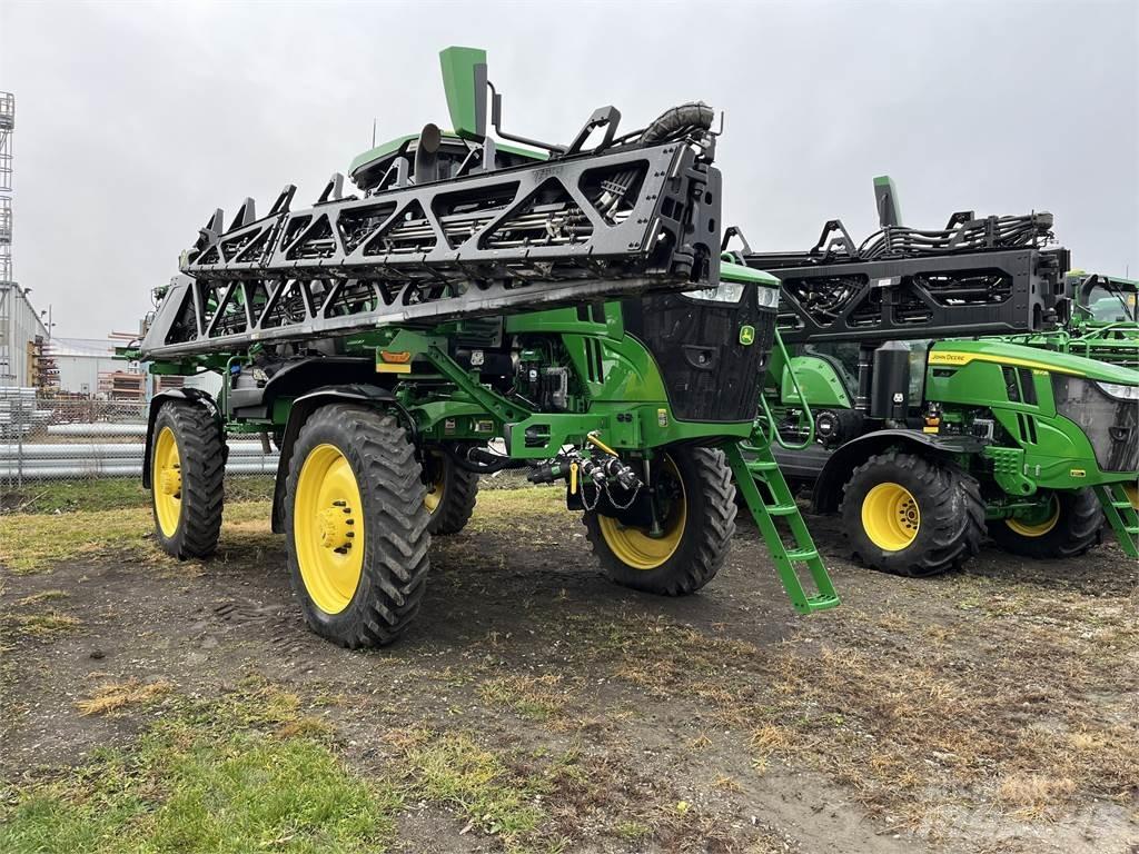 John Deere 412R Prikabinami purkštuvai