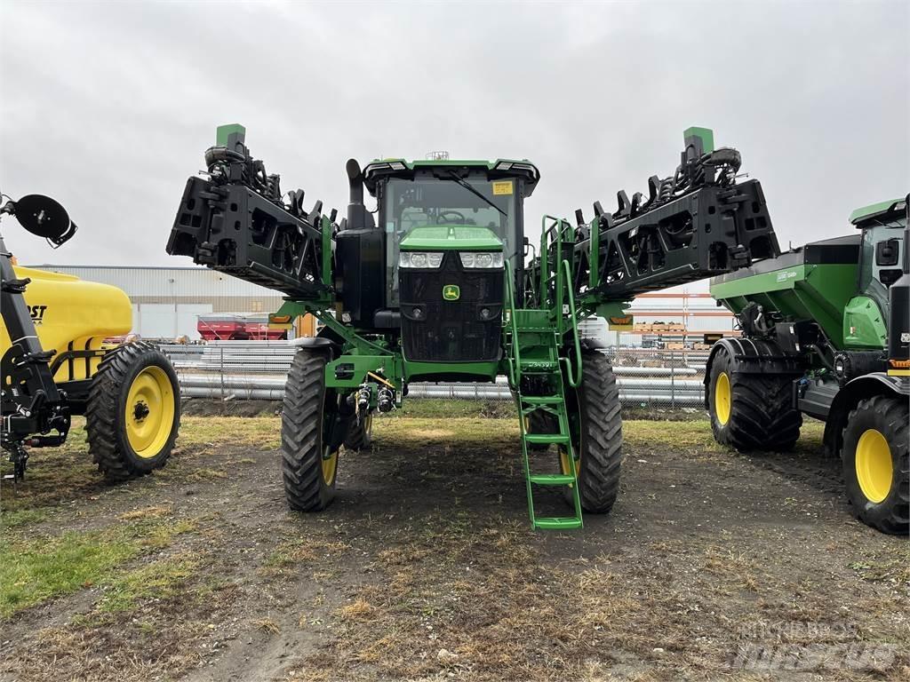 John Deere 412R Prikabinami purkštuvai
