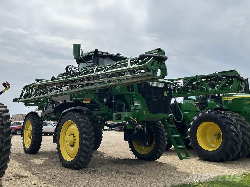 John Deere 412R Prikabinami purkštuvai
