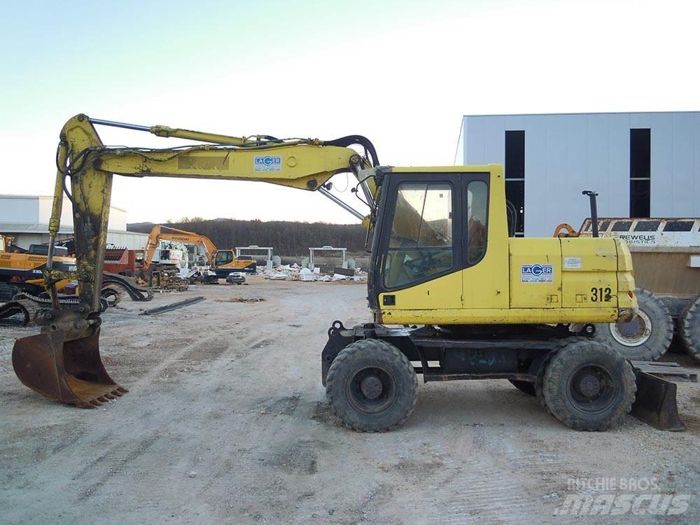 CAT M312 Ratiniai ekskavatoriai