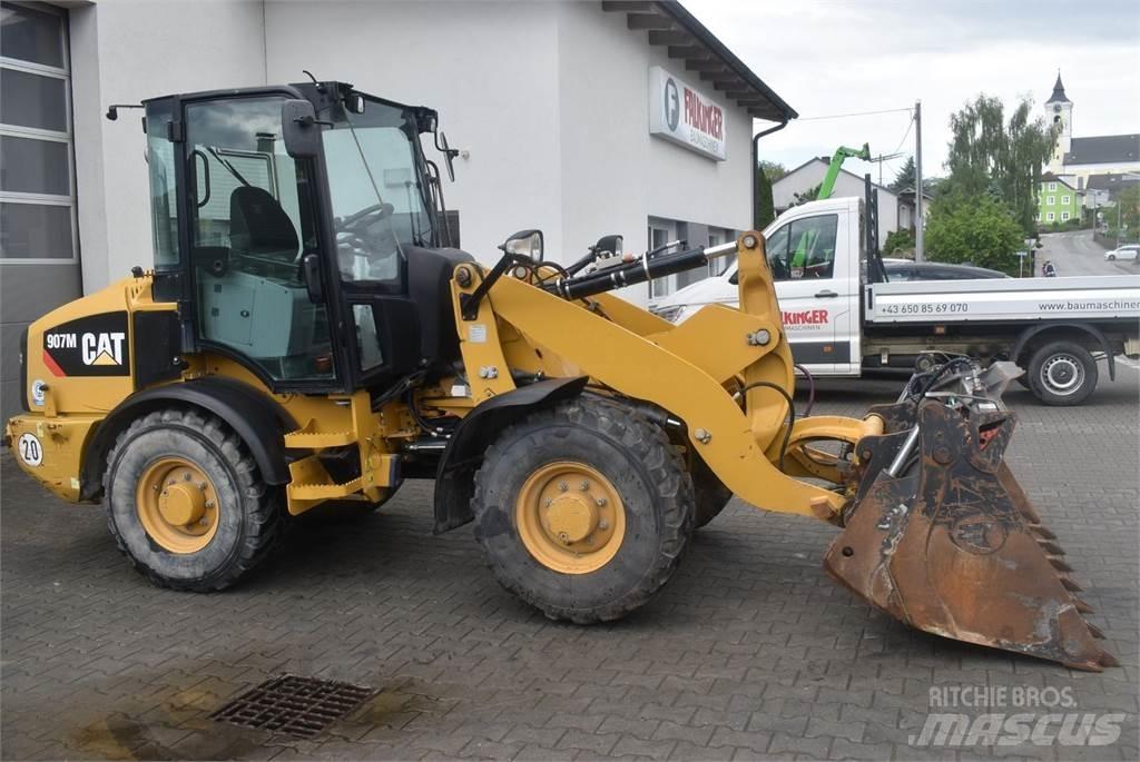 CAT 907M Naudoti ratiniai krautuvai