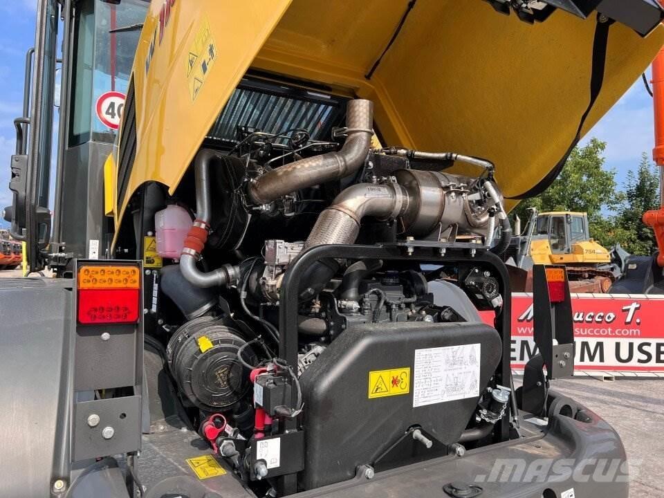 New Holland W110D Naudoti ratiniai krautuvai