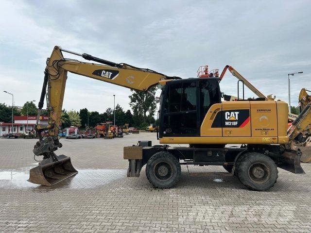 CAT M318F Statyba - Kita
