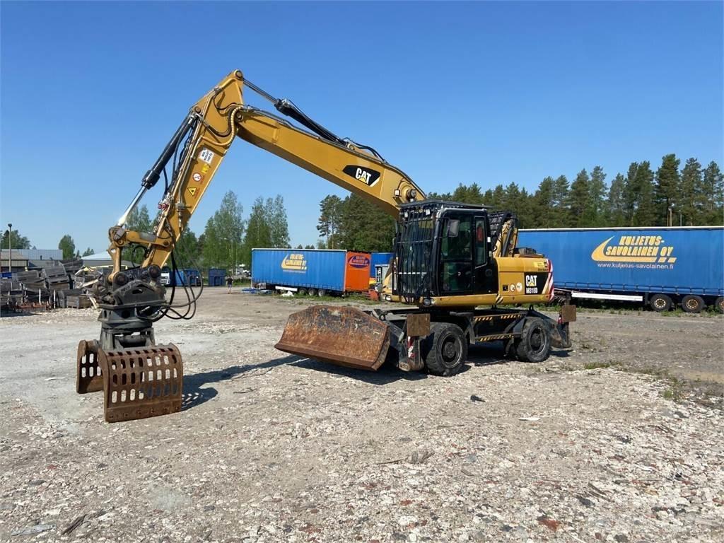 CAT M318D Krovimas/Kėlimas - Kita