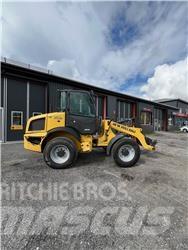 New Holland W70C Naudoti ratiniai krautuvai