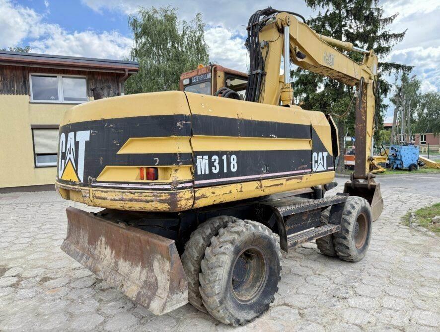 CAT M318 Ratiniai ekskavatoriai